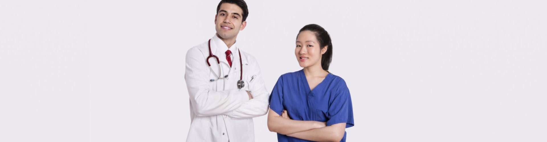 male doctor and female nurse smiling